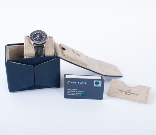 Box / Paper shot of Navitimer Auto GMT 41