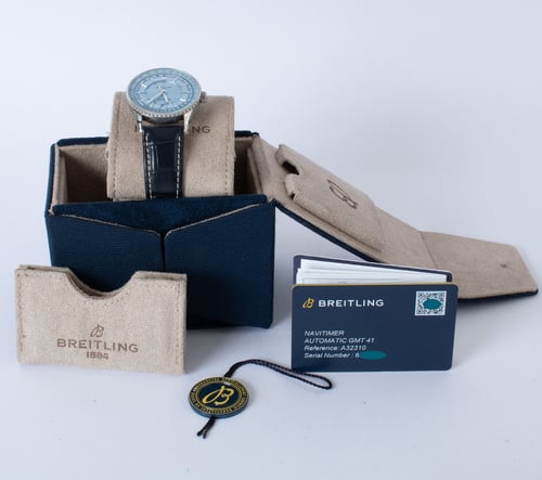 Box / Paper shot of Navitimer Auto GMT 41