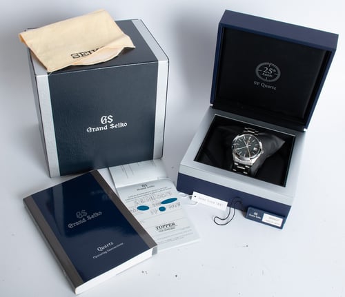 Box / Paper shot of Elegance GMT Caliber 9F 25TH Anniversary LE