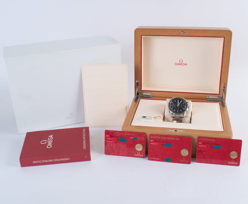Box / Paper shot of Speedmaster Moonphase Chronograph