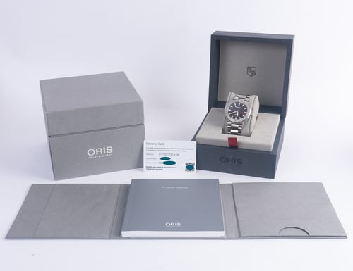Box / Paper shot of Aquis Date Cherry Edition