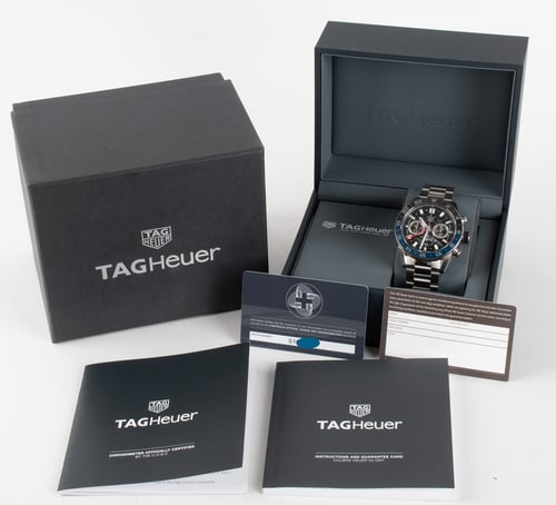 Box / Paper shot of Carrera Calibre Heuer 02 Chronograph GMT