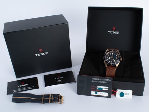 Box / Paper shot of Black Bay Bronze Bucherer