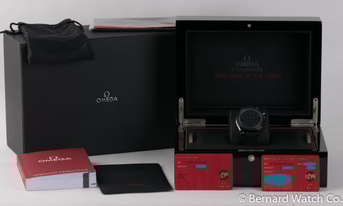 Box / Paper shot of Speedmaster Dark Side of the Moon 'Black Black'